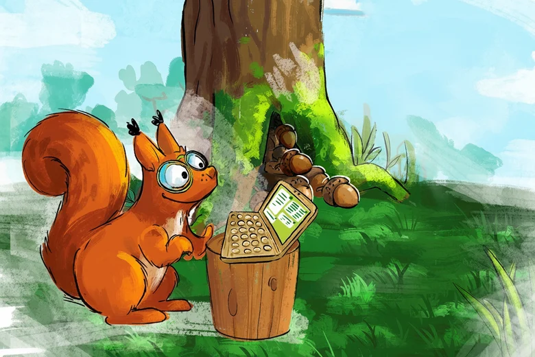 Eichhörnchen Volker sitzt am PC. Im Hintergrund ist ein Baum zu sehen.